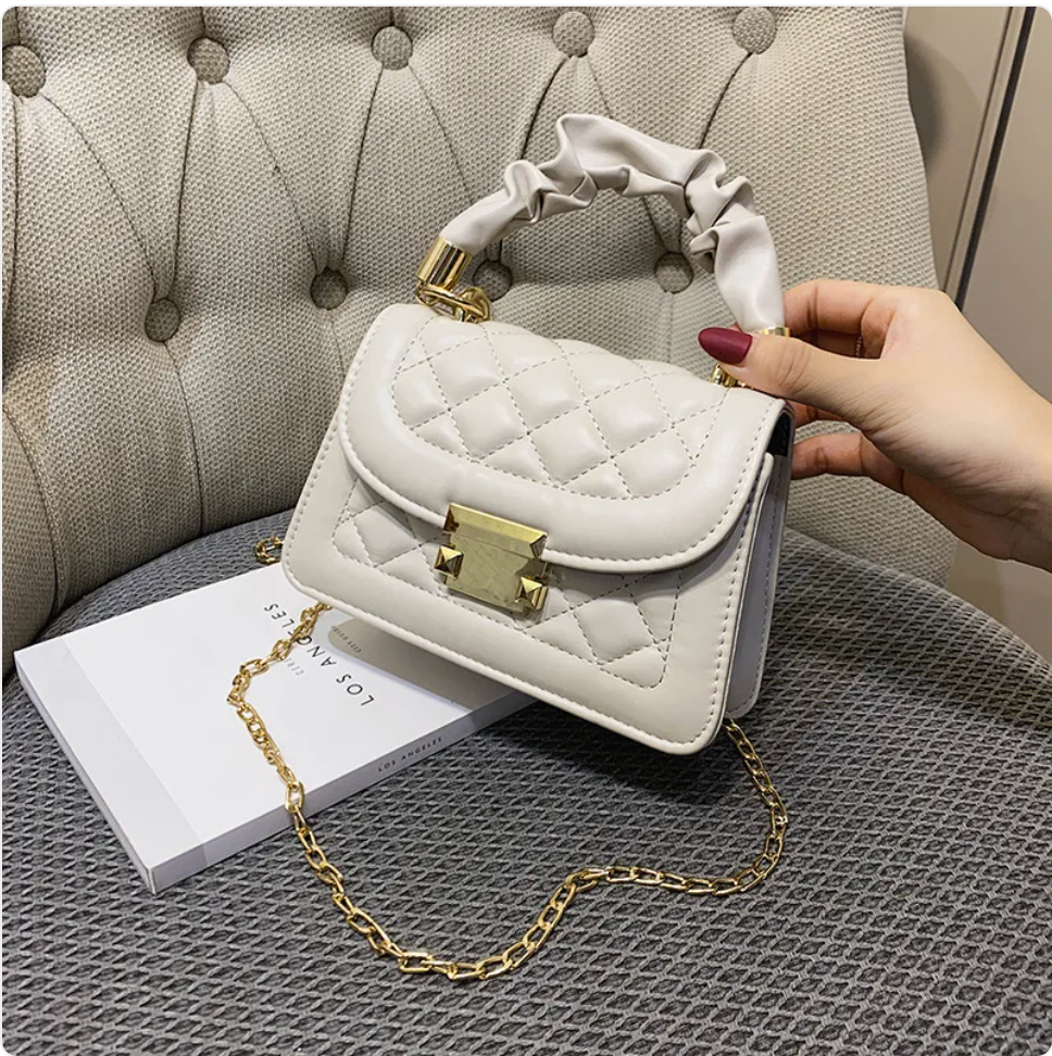 Small & Sophisticated Lockable Leather Handbag