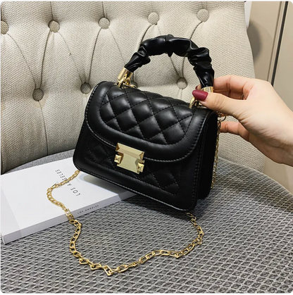Small & Sophisticated Lockable Leather Handbag