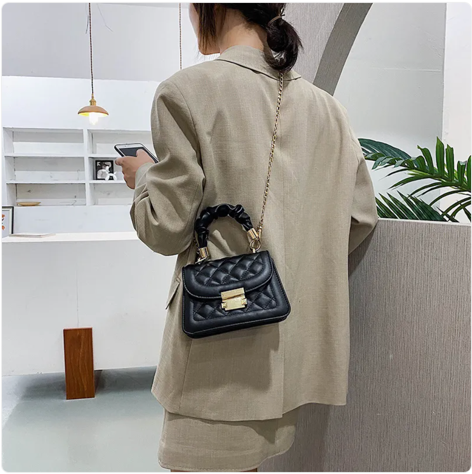 Small & Sophisticated Lockable Leather Handbag